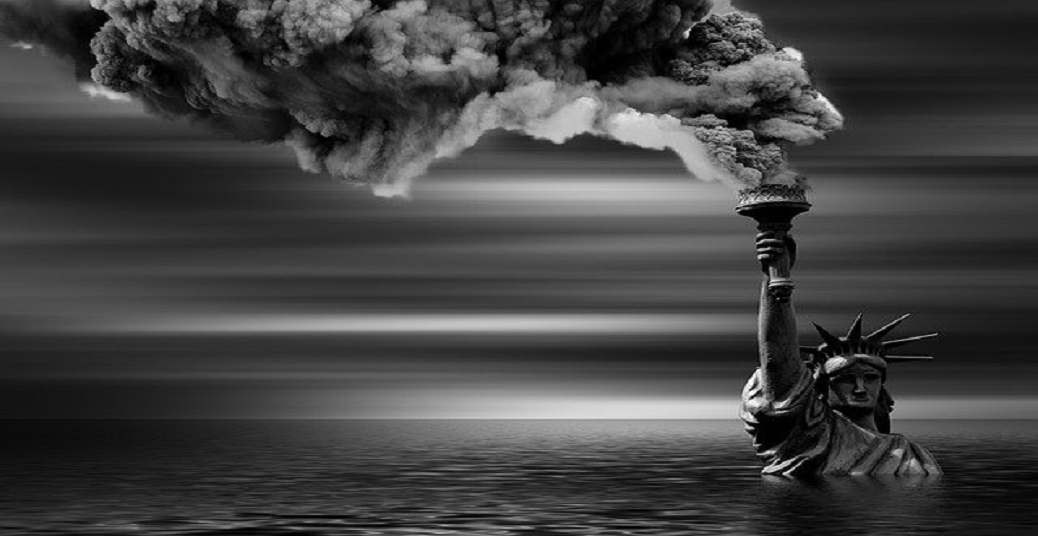 This is a black and white photo of the Statue of Liberty with giant plumes of smoke coming off her.